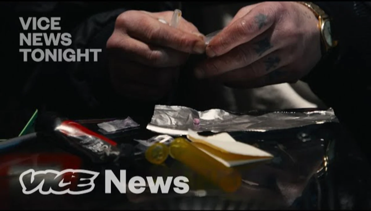 VICE News cover for Benzo Dope, showing a man's hands and drug paraphernalia, such as tin foil.