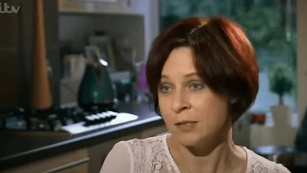 Lucy Rocca sitting at a table in her kitchen for her interview featured in Britain's Secret Drinkers