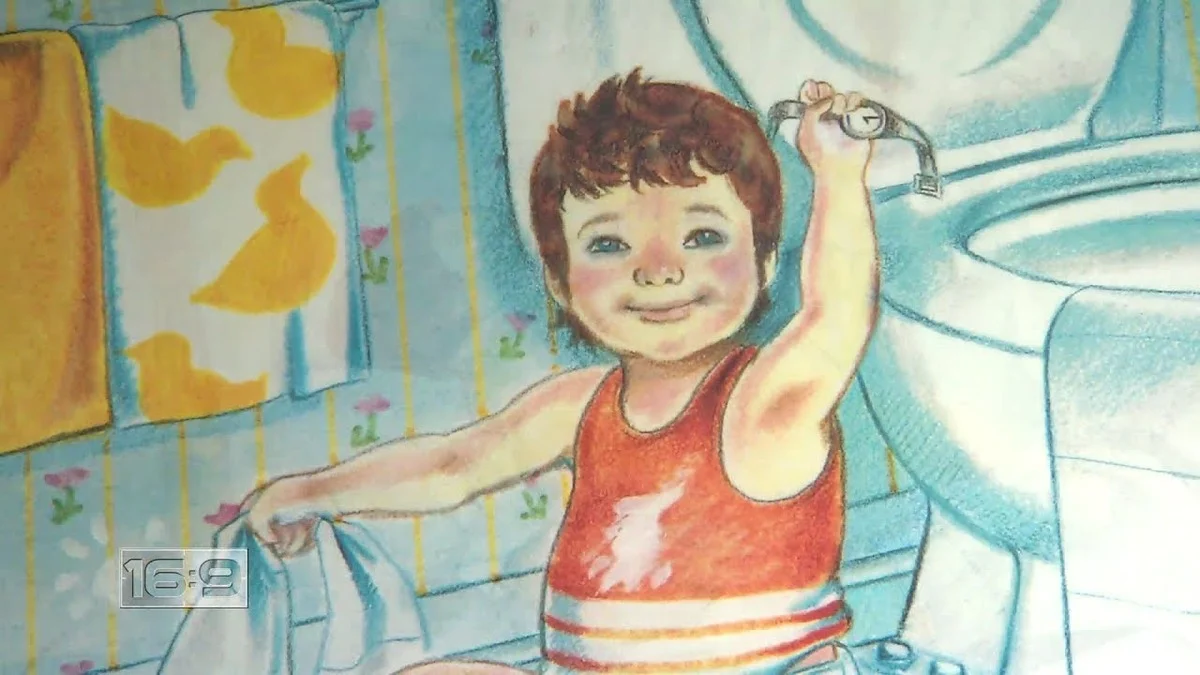 A smiling toddler in a red tank top and striped shorts sits next to a toilet, holding a hand towel and reaching for the flush handle. Cover artwork for the book Love You Forever by Robert Munsch.