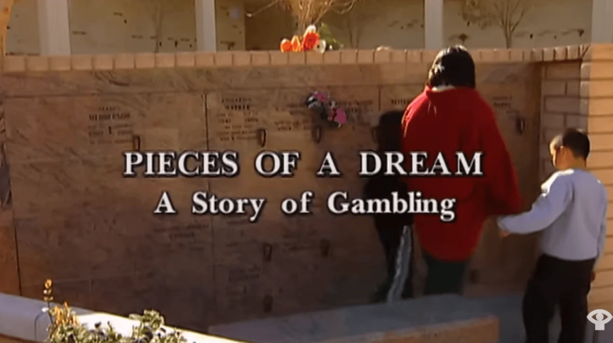 A woman and two children standing in front of a wall with names and flowers on it, with the title, "Pieces of a Dream: A Story of Gambling".