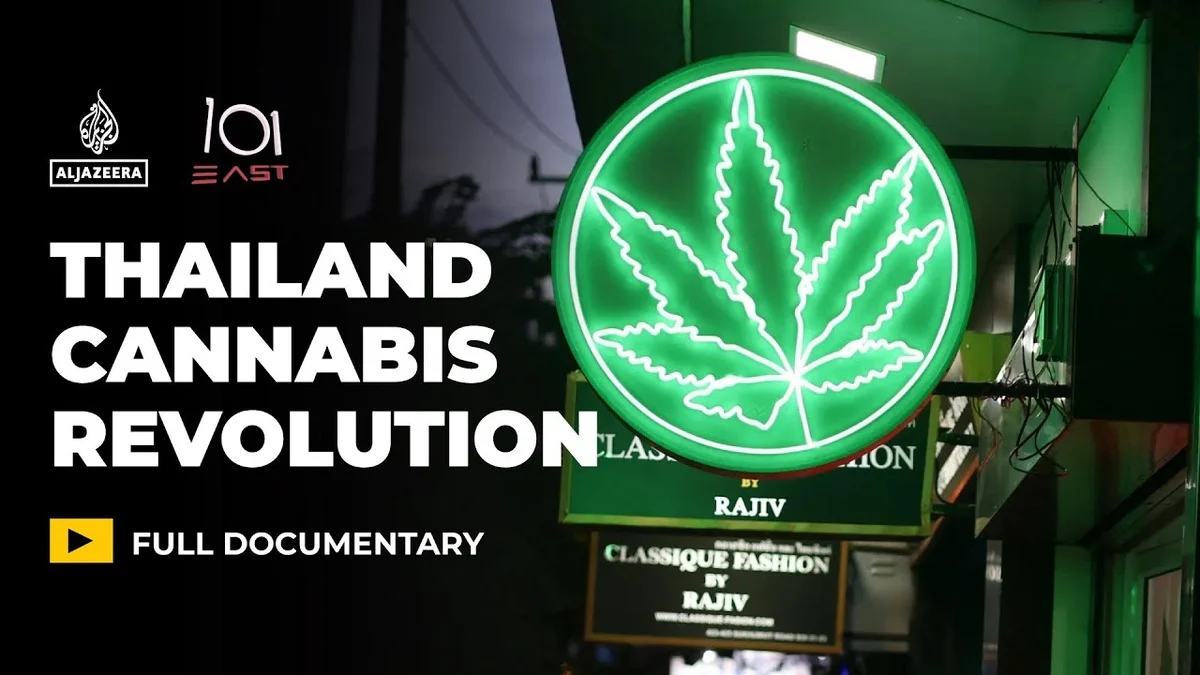 Neon green cannabis leaf sign illuminated at night, next to text reading 'Thailand Cannabis Revolution' and 'Full Documentary,' Al Jazeera and 101 East logos present.